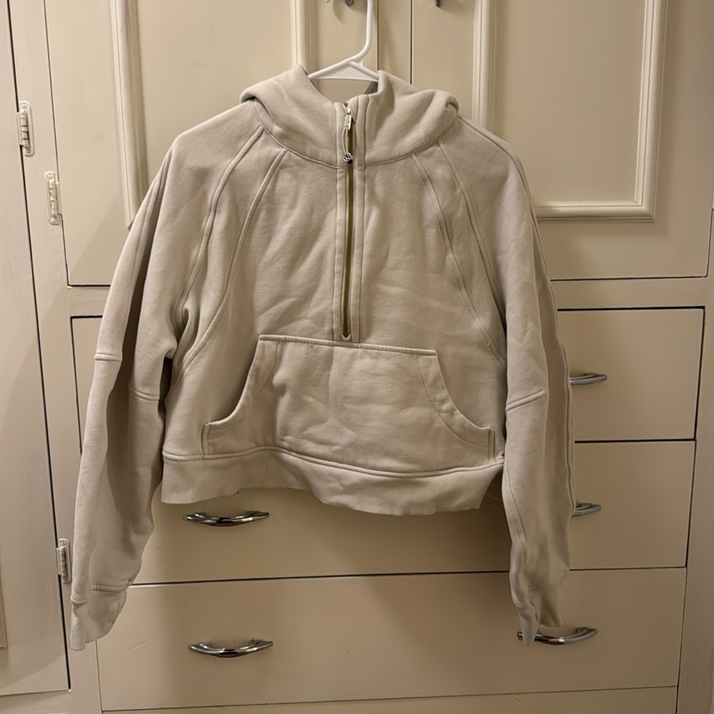 Cream colored lululemon half zip with hood and thumb holes
